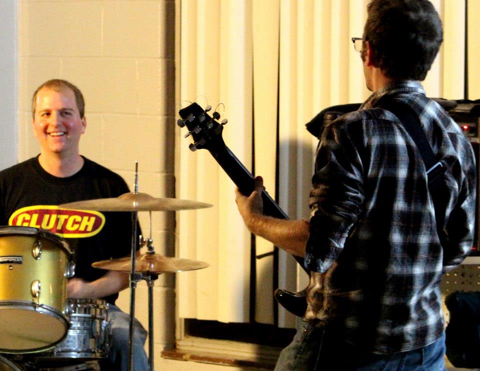 Tom honing his favorite pass time with his brother.jpg